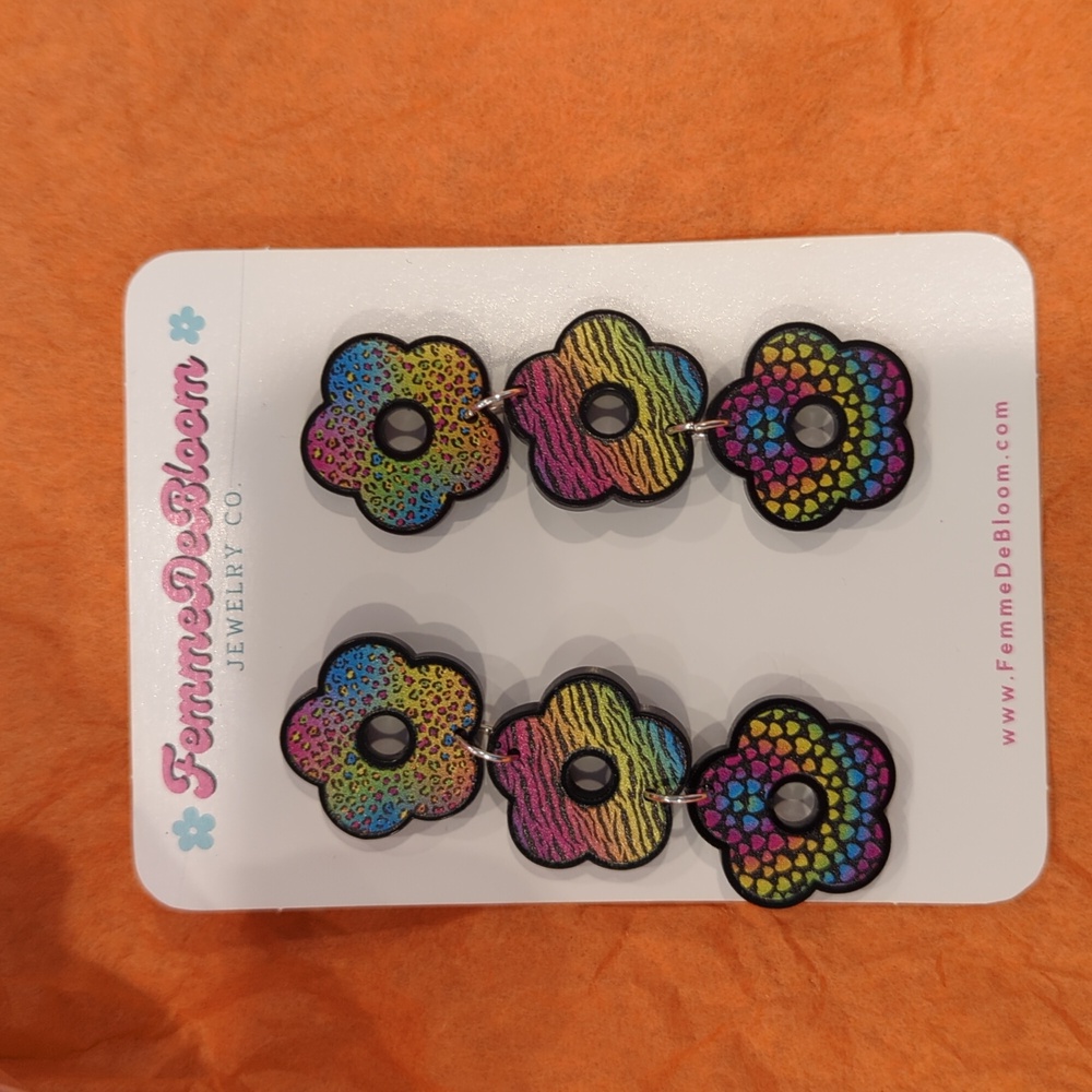Never worn Lisa Frank-inspired earrings on sterling silver posts.